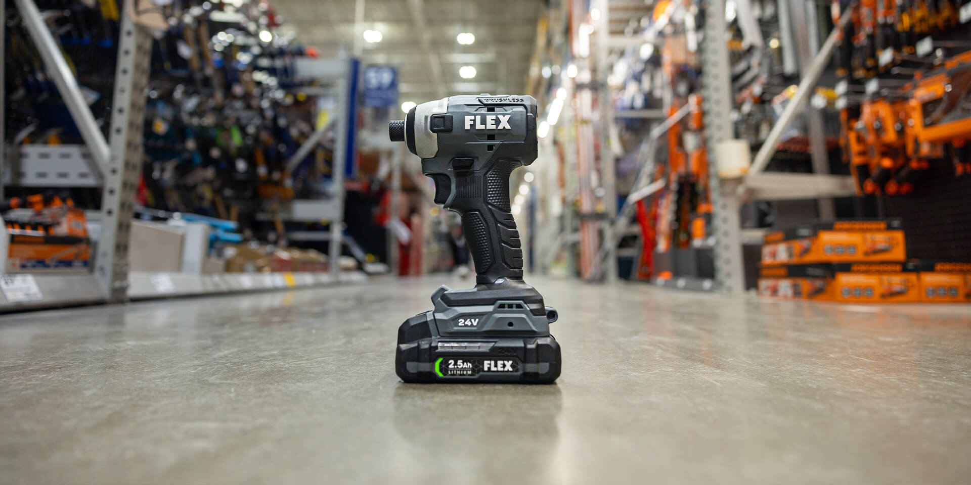Flex brand drill sitting in the aisle of a Lowes Home Improvement. 